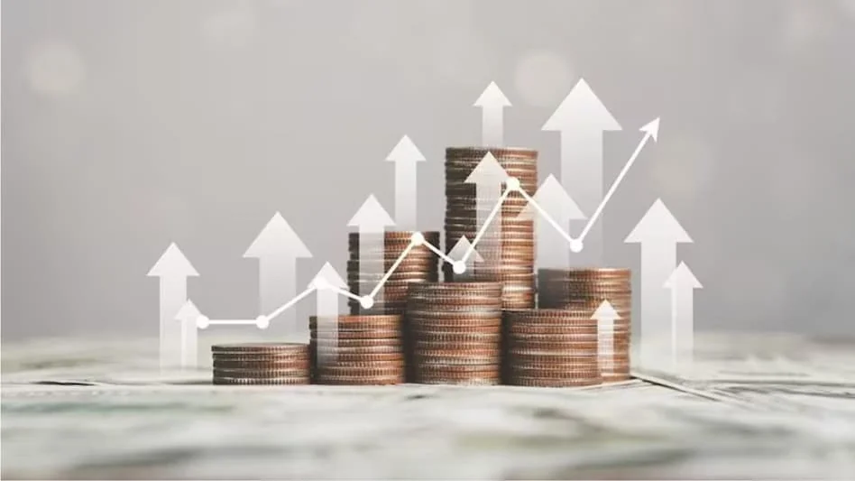 Stacked coins with upward growth arrows representing long-term SWP performance, as taken from [BusinessToday](https://www.businesstoday.in/mutual-funds/story/top-hybrid-mutual-funds-for-swp-which-schemes-generated-the-highest-regular-income-over-10-years-541013-2026-07-05)